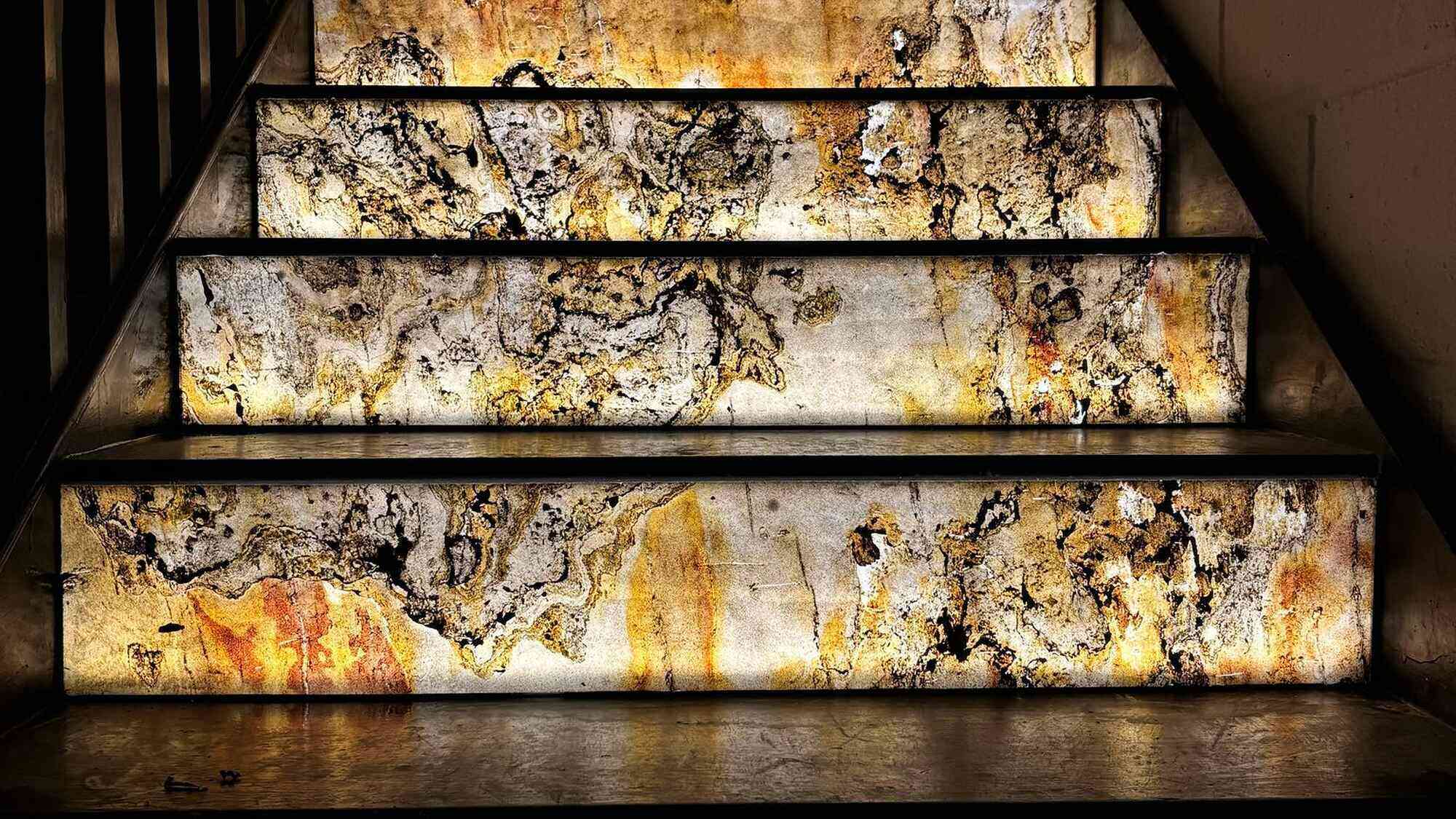 Amber backlit stone staircase in a restaurant fit-out