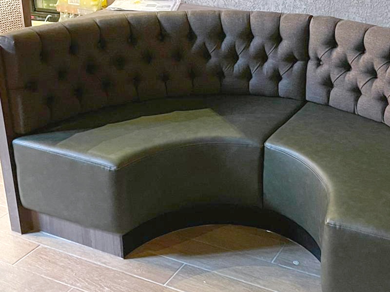 Deep buttoned half round booth seating