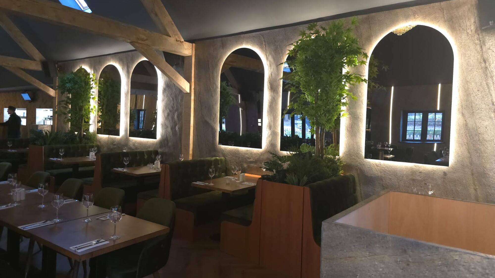 Illuminated stone arches in a restaurant